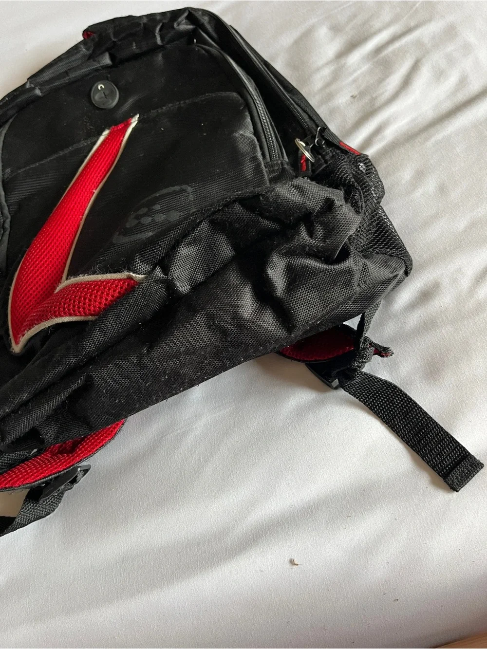 Black & Red Multi-Pocket Backpack with Media Port & Mesh Side Pockets